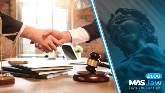 Lawyer and client shaking hands.